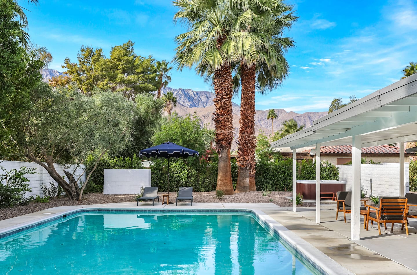 The Kasbah’s saltwater pool, palms, covered patio, and mountain views